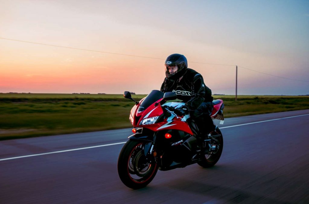 Motoryclist at sunset | Featured image for the Easy Car Finance page from eCarz.