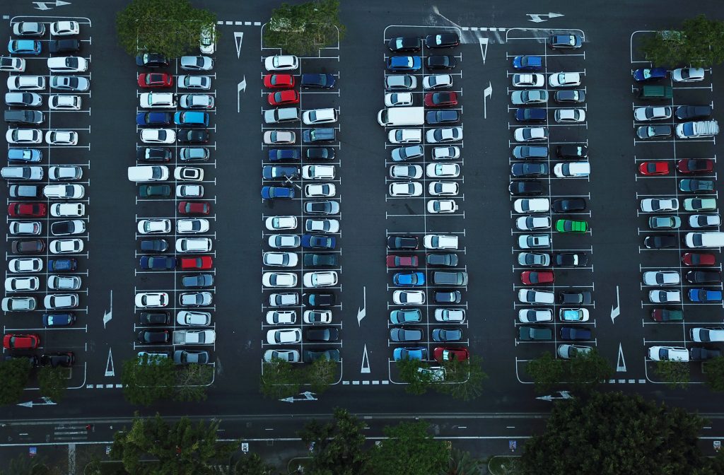 Aerial view of a parking lot | Featured image for guide to buying a used car blog by eCarz.