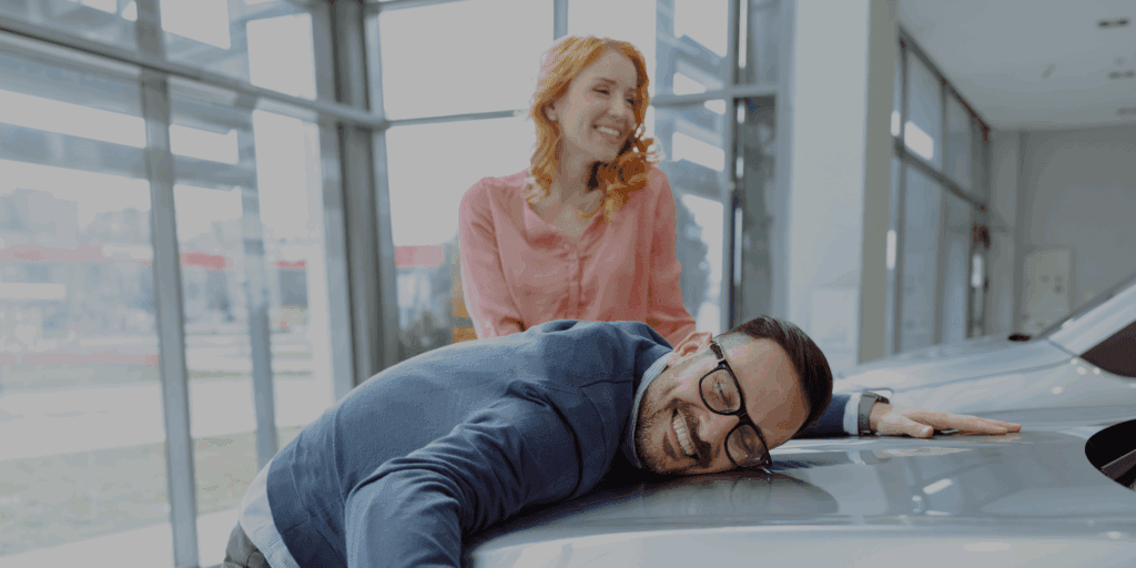 Guy hugging new car - How to Maximise the Value of a Trade-In with a Car Buying Service
